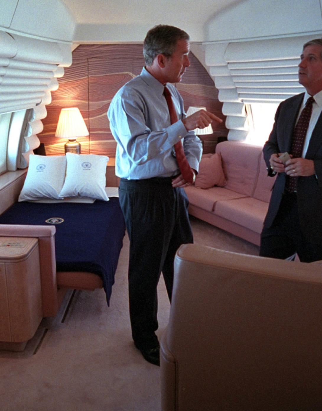 President George W. Bush confers with White House Chief of Staff Andrew Card, September 11, 2001, in the President's bedroom aboard Air Force One. (P7067-32)
