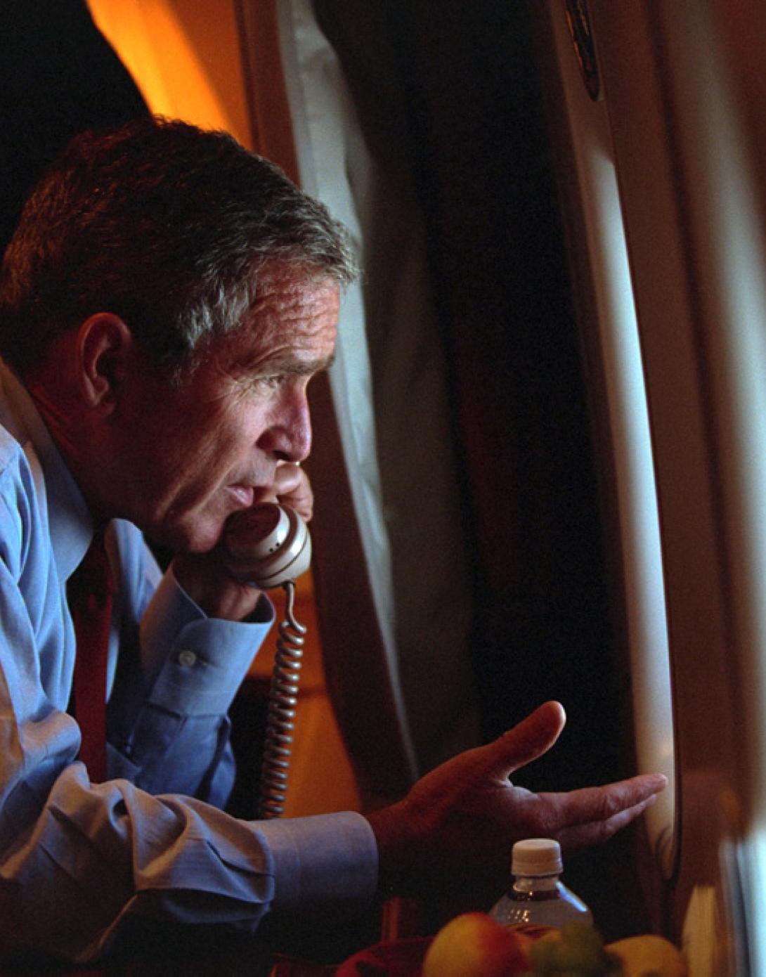 After departing Offutt Air Force Base in Nebraska, President George W. Bush confers with Vice President Dick Cheney from Air Force One, September 11, 2001, during the flight to Andrews Air Force Base. (P7091-18)