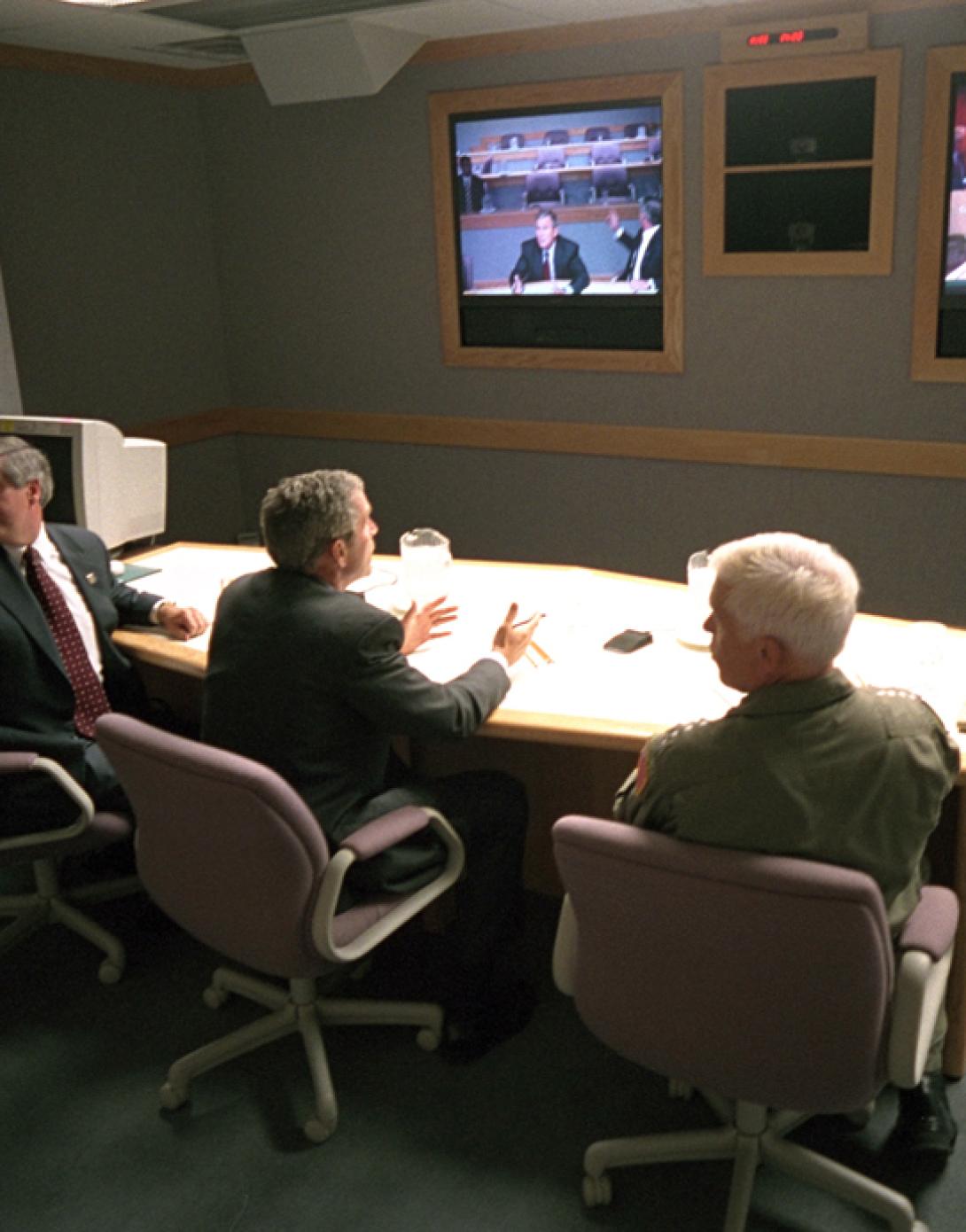President George W. Bush, White House Chief of Staff Andy Card (left) and Admiral Richard Mies conduct a video teleconference, September 11, 2001, at Offutt Air Force Base in Nebraska. (P7093-16)