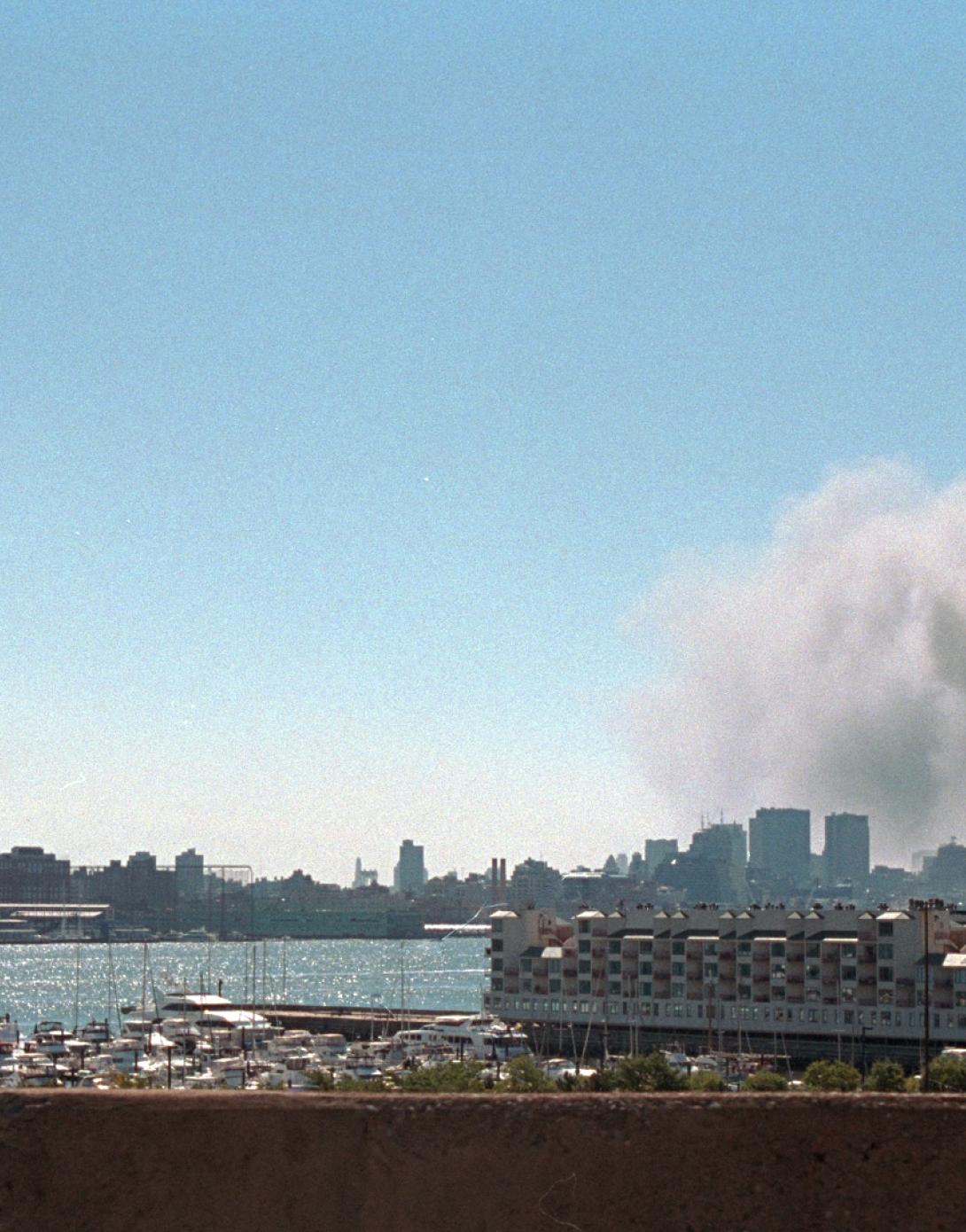 Smoke rises from the site of the World Trade Center, September 11, 2001. (P7127-23)