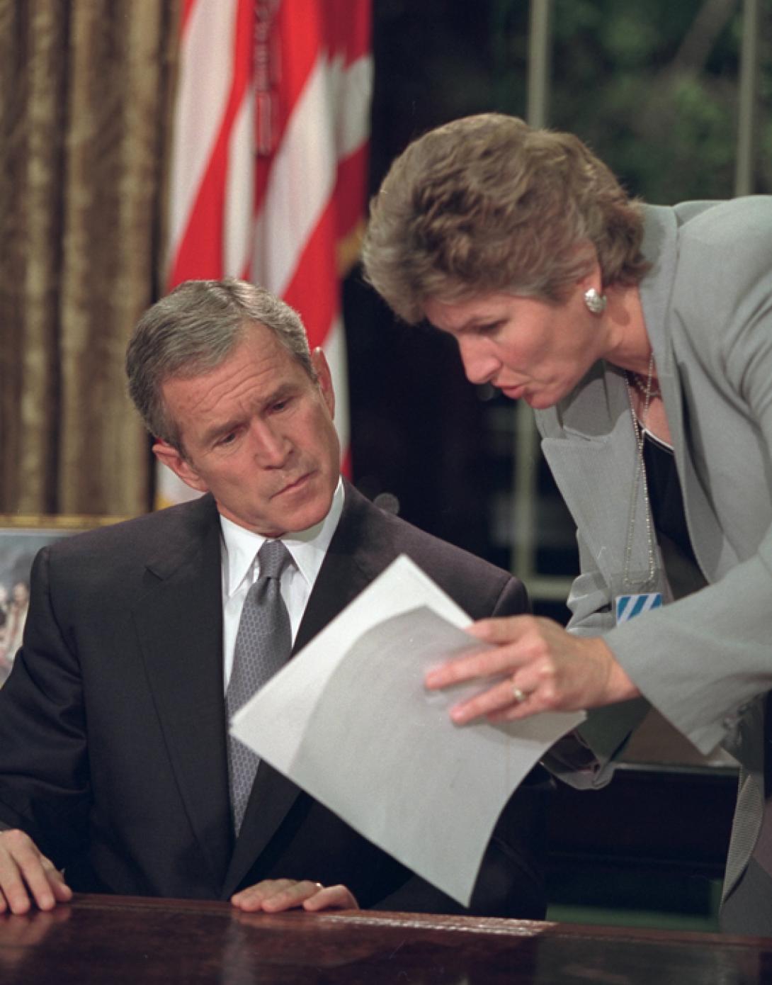 President George W. Bush reviews his statement with Karen Hughes, Counselor to the President, September 11, 2001, before addressing the nation from the Oval Office. (P7132-04)