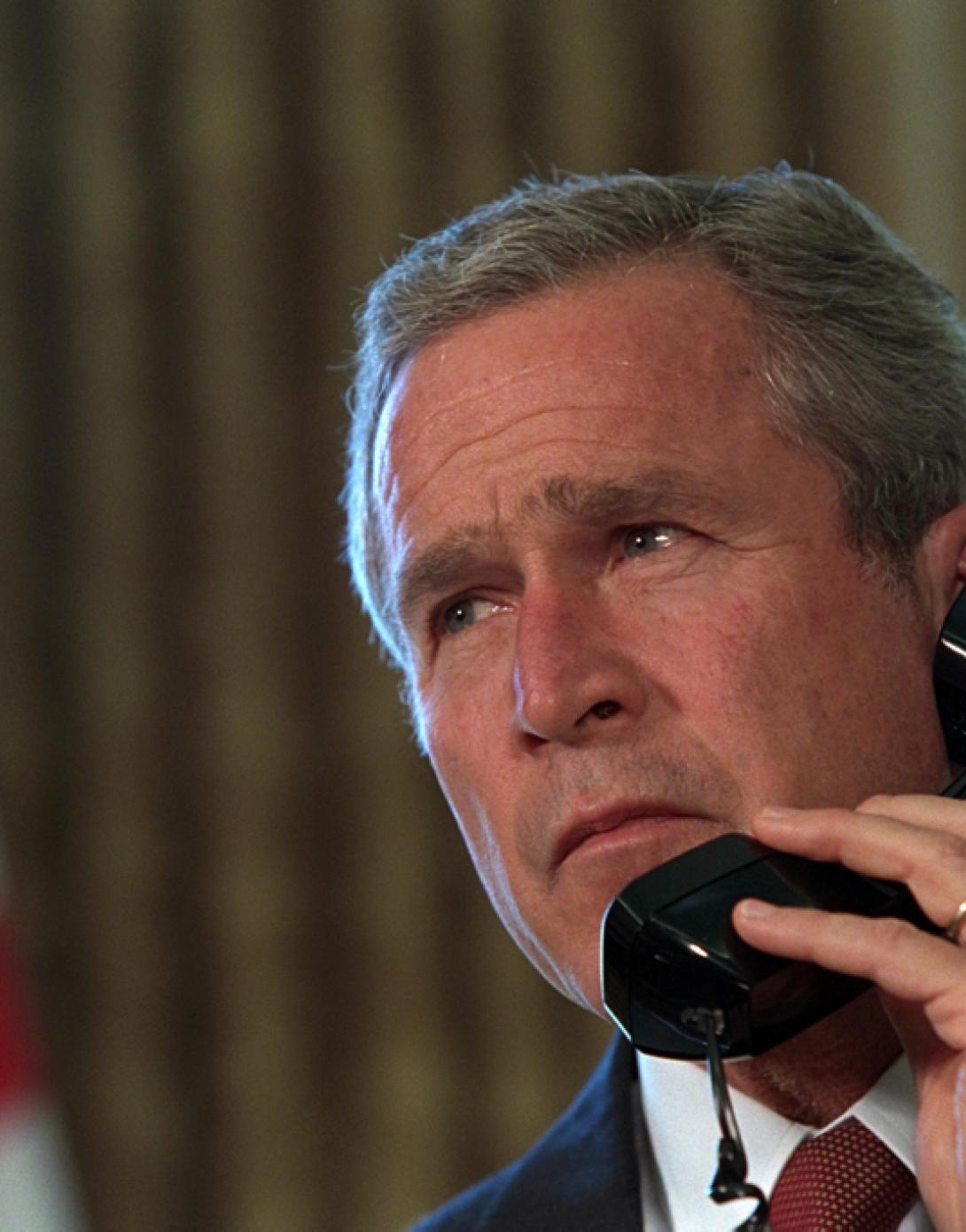 Pledging support for New York, President George Bush talks with Governor George Pataki and New York City Mayor Rudolph Giuliani, September 13, 2001, in a televised telephone conversation from the Oval Office. (P7267-24)