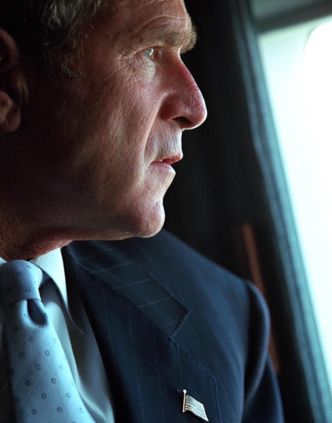 President George W. Bush surveys the damage to the Pentagon from the presidential helicopter, Marine One, September 14, 2001, as he travels to New York City. (P7356-13)