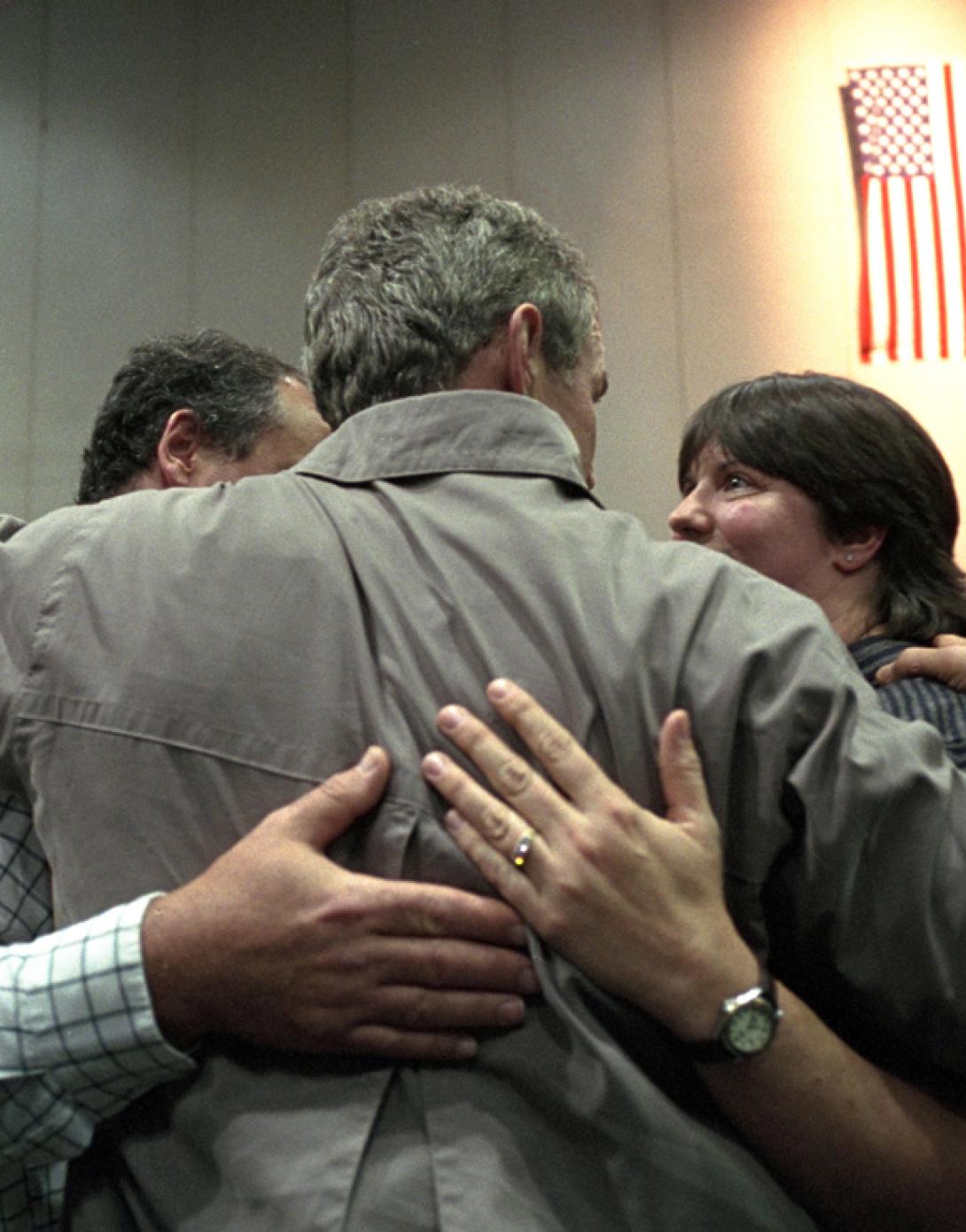 President George W. Bush consoles a family, September 14, 2001, during his trip to New York City. (P7385-12)