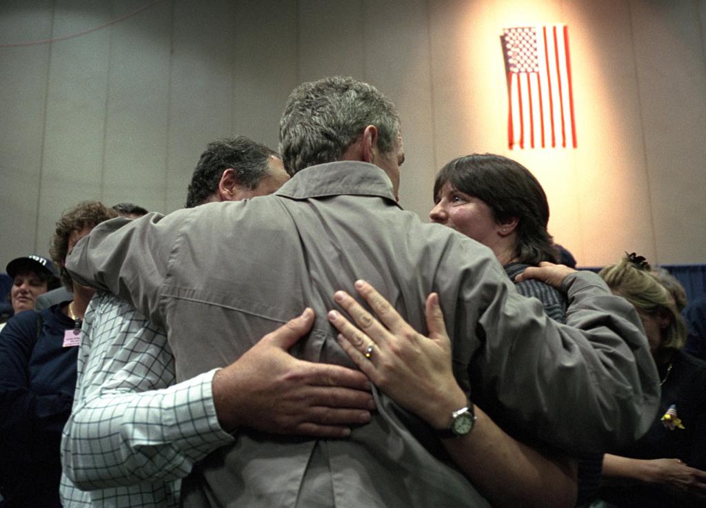 President George W. Bush consoles a family, September 14, 2001, during his trip to New York City. (P7385-12)