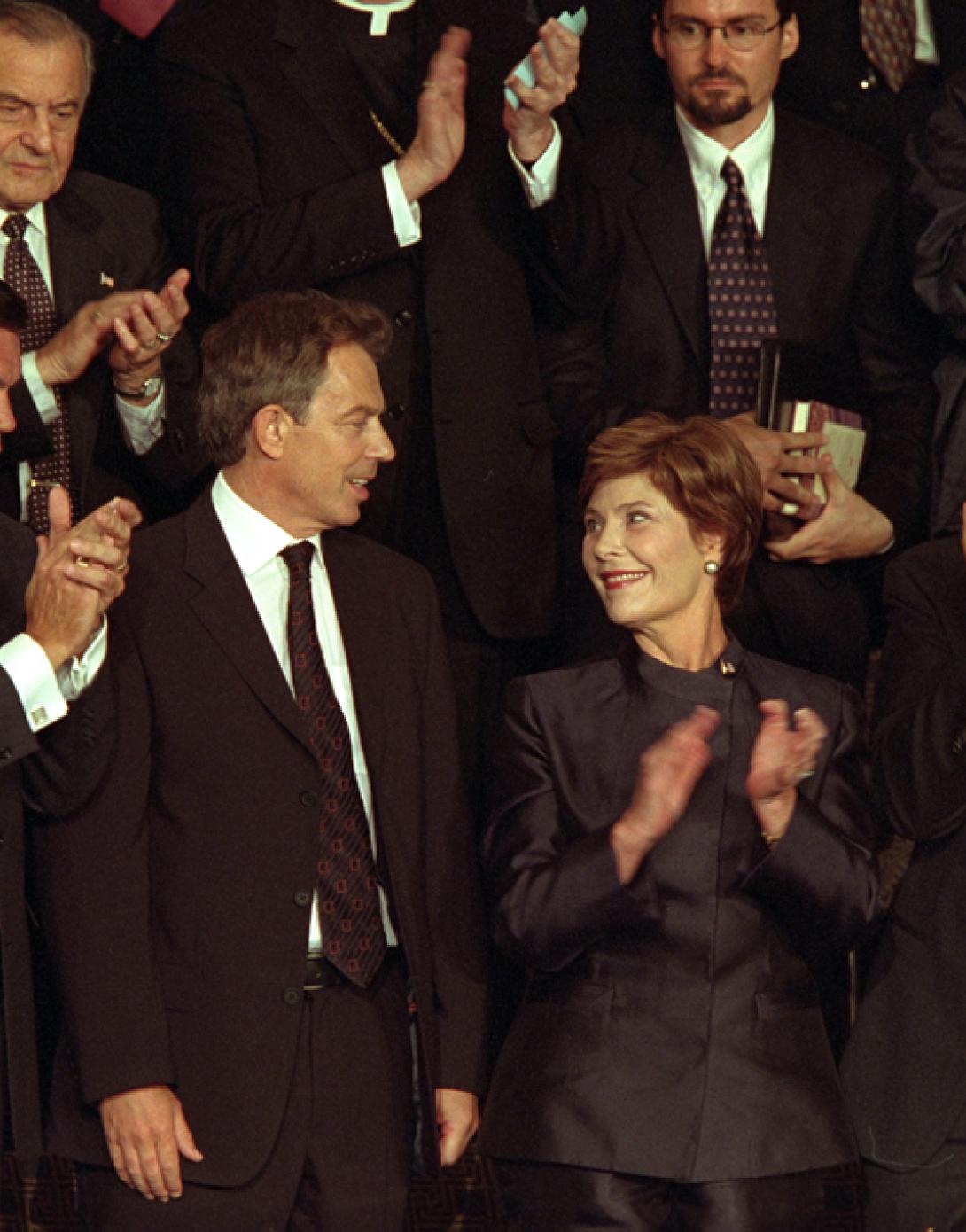 British Prime Minister Tony Blair receives applause as he stands with Mrs. Laura Bush during a televised national address to the joint session of Congress, September 20, 2001. (P7632-15)