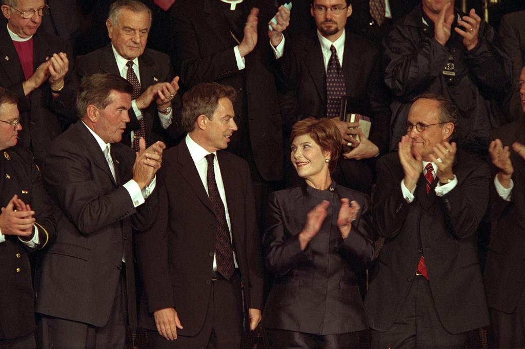 British Prime Minister Tony Blair receives applause as he stands with Mrs. Laura Bush during a televised national address to the joint session of Congress, September 20, 2001. (P7632-15)