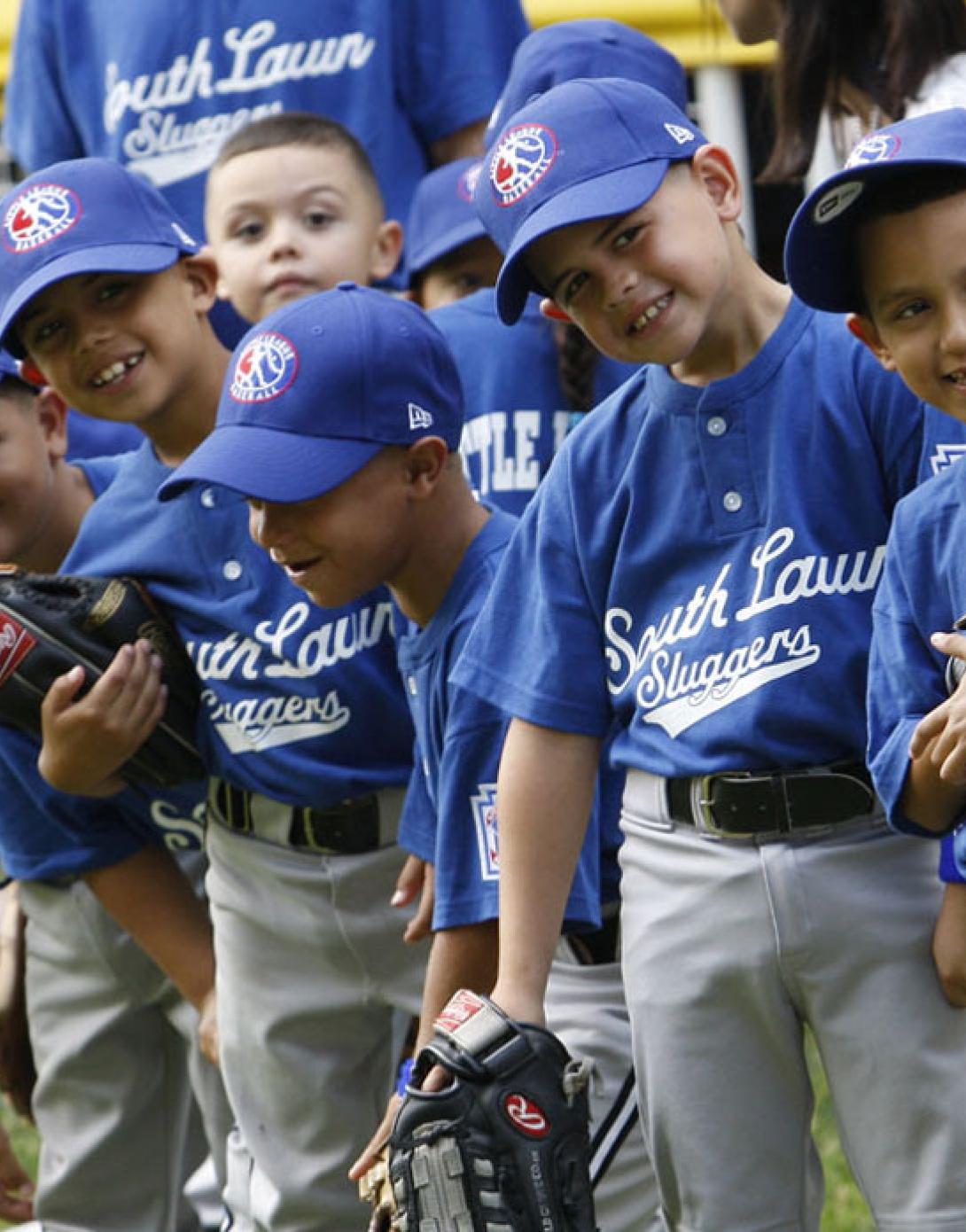 Players of the Jose M. Rodriguez Little League Angels look toward President George W. Bush.
