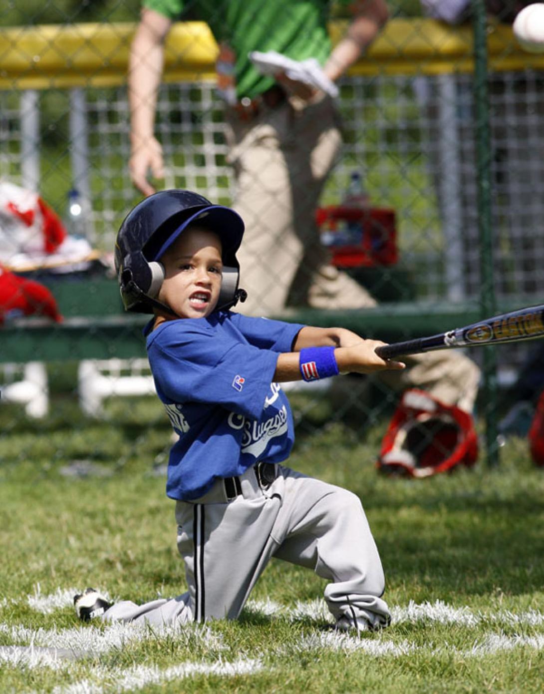 A player hits the ball during the season opener.