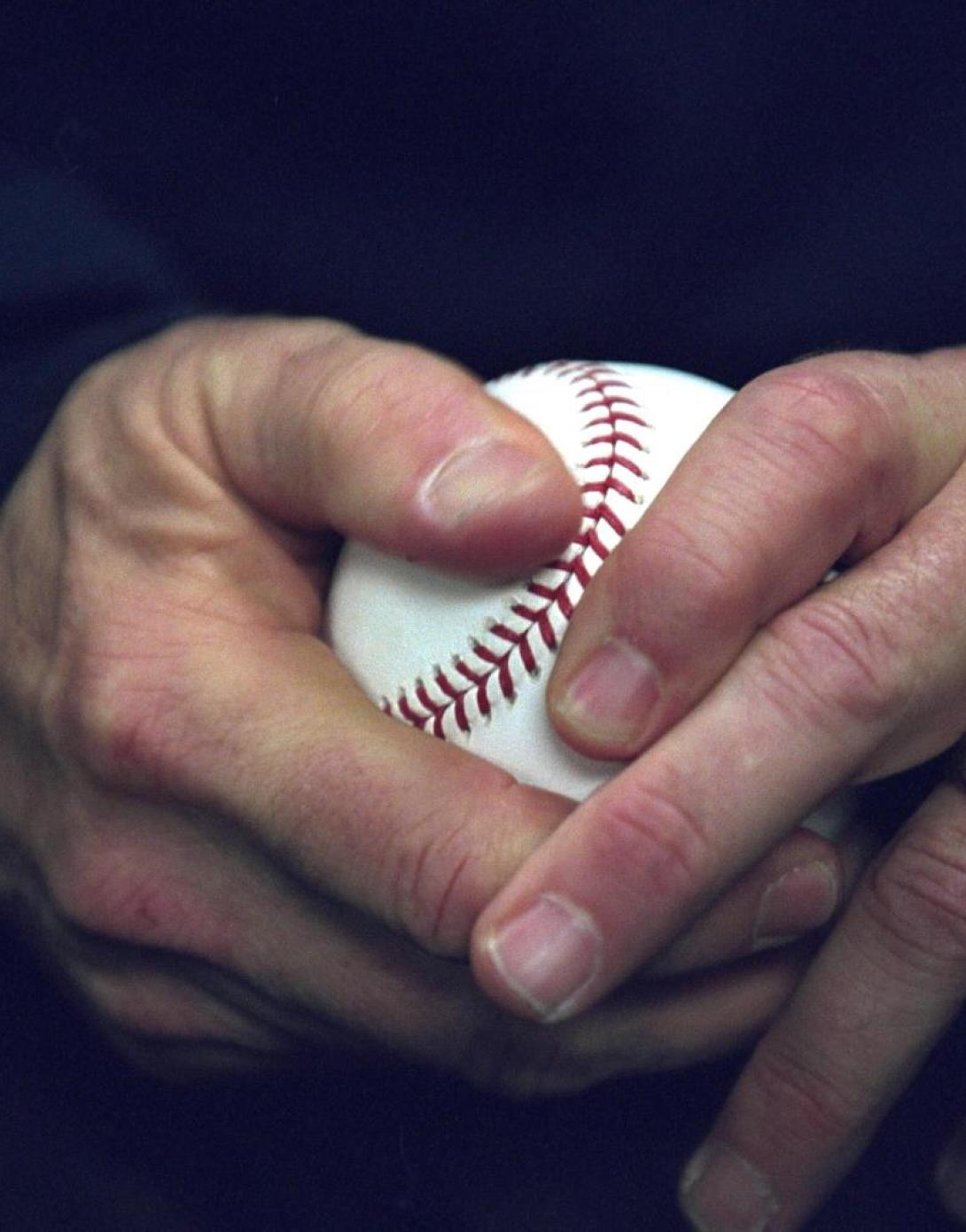 President George W. Bush holds a baseball, October 30, 2001, as he approaches the playing field at Yankee Stadium to throw out the ceremonial first pitch for Game Three of the World Series in New York City. (P9151-15)