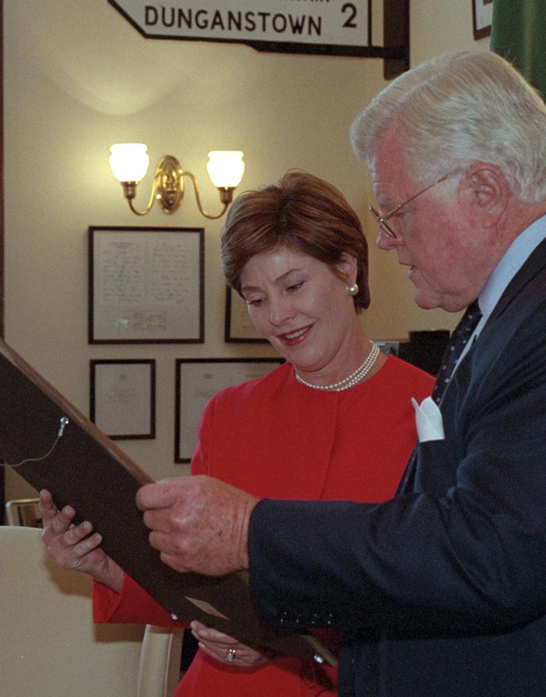 Senator Ted Kennedy shows Mrs. Laura Bush art and memorabilia in his office at the Russell Senate Office Building, September 11, 2001.