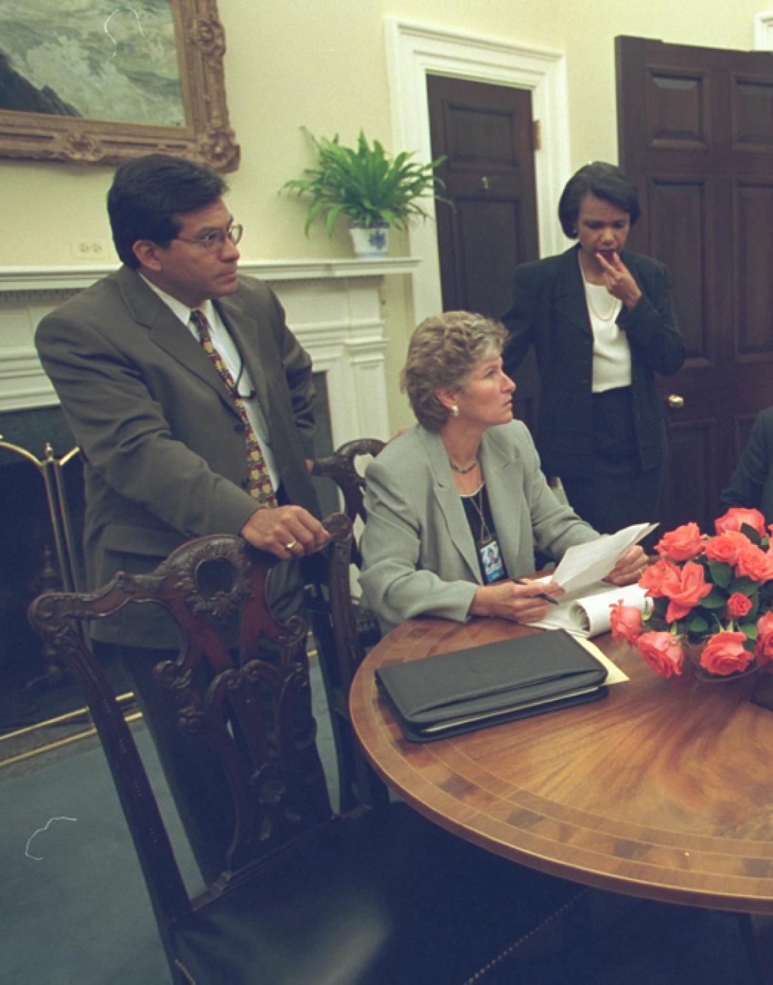 Working with his Senior Staff, President George W. Bush reviews a speech regarding the day's terrorist attacks that he will deliver to the Nation from the Oval Office, September 11, 2001.