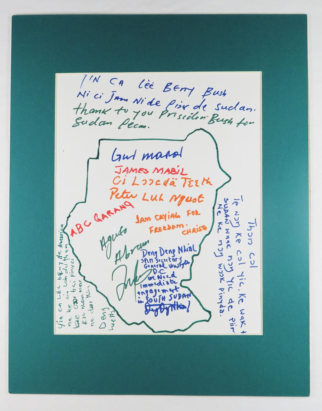Drawing of Sudan with messages from gifters, Lost Boys of Sudan, Nashville, Tennessee. Presented to President Bush in the Roosevelt Room after his signing of the Sudan Peace Act (HR 5531) in October 2002.