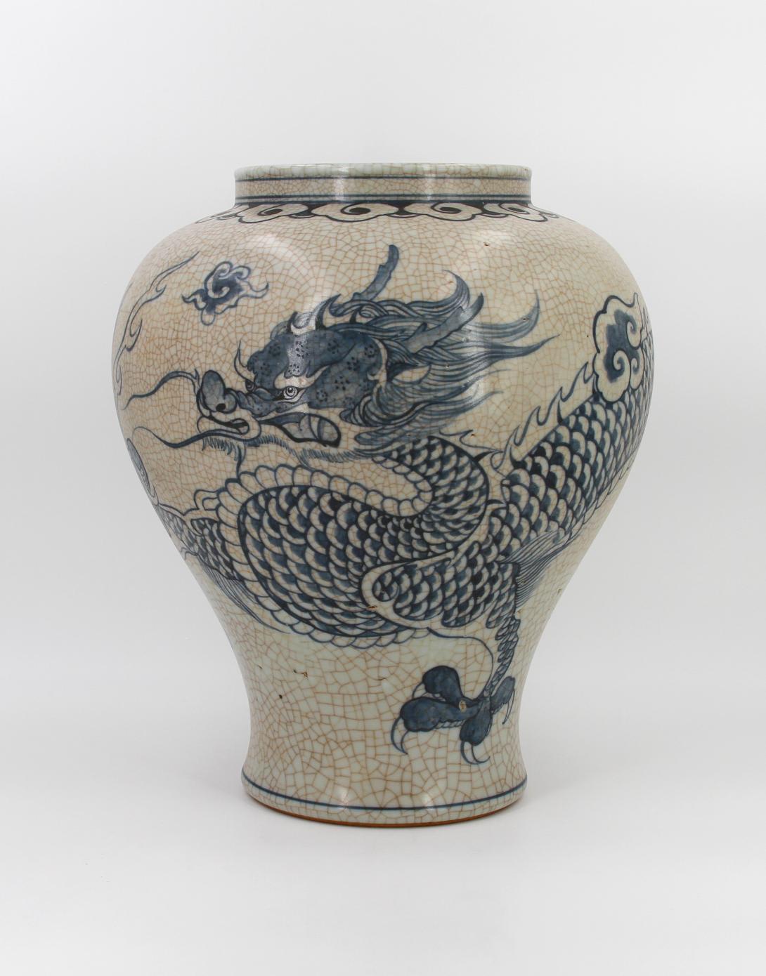 Speckled-brown vase decorated in blue with a continuous five clawed dragon and scattered flaming pearl devices. The form features a straight wide neck with a collared rim, made by Park, Kung Sun; signed on bottom. Gifted by Roh Moo-hyun, President of the Republic of Korea.