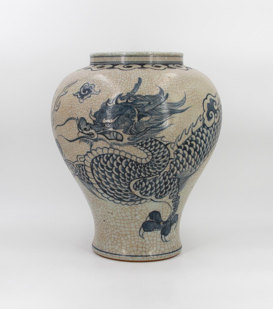 Speckled-brown vase decorated in blue with a continuous five clawed dragon and scattered flaming pearl devices. The form features a straight wide neck with a collared rim, made by Park, Kung Sun; signed on bottom. Gifted by Roh Moo-hyun, President of the Republic of Korea.
