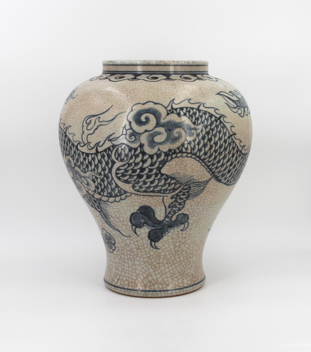 Speckled-brown vase decorated in blue with a continuous five clawed dragon and scattered flaming pearl devices. The form features a straight wide neck with a collared rim, made by Park, Kung Sun; signed on bottom. Gifted by Roh Moo-hyun, President of the Republic of Korea.
