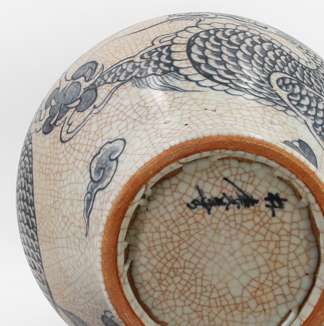 Speckled-brown vase decorated in blue with a continuous five clawed dragon and scattered flaming pearl devices. The form features a straight wide neck with a collared rim, made by Park, Kung Sun; signed on bottom. Gifted by Roh Moo-hyun, President of the Republic of Korea.