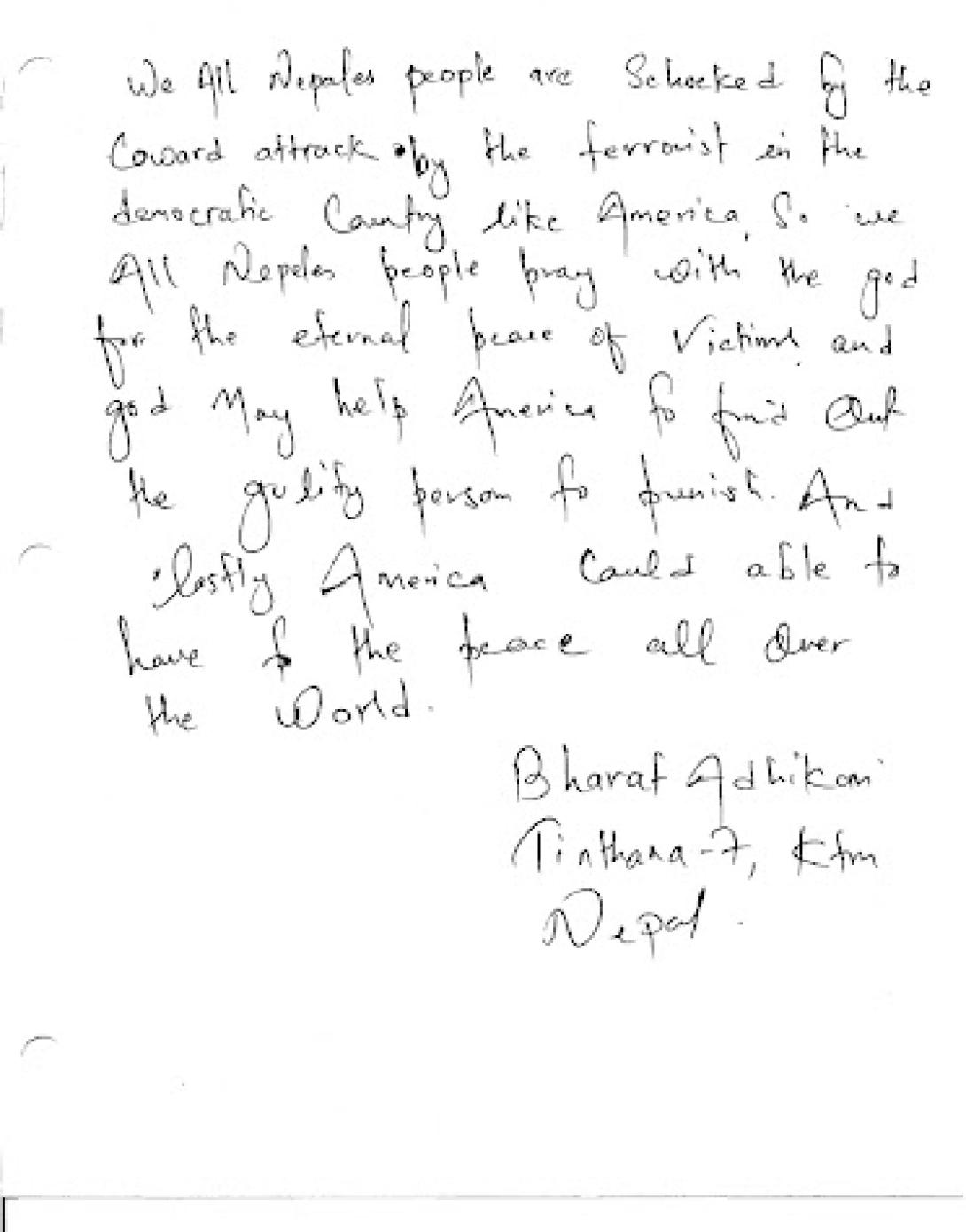 A citizen of the Federal Democratic Republic of Nepal offers Americans a message of encouragement in a condolence book.