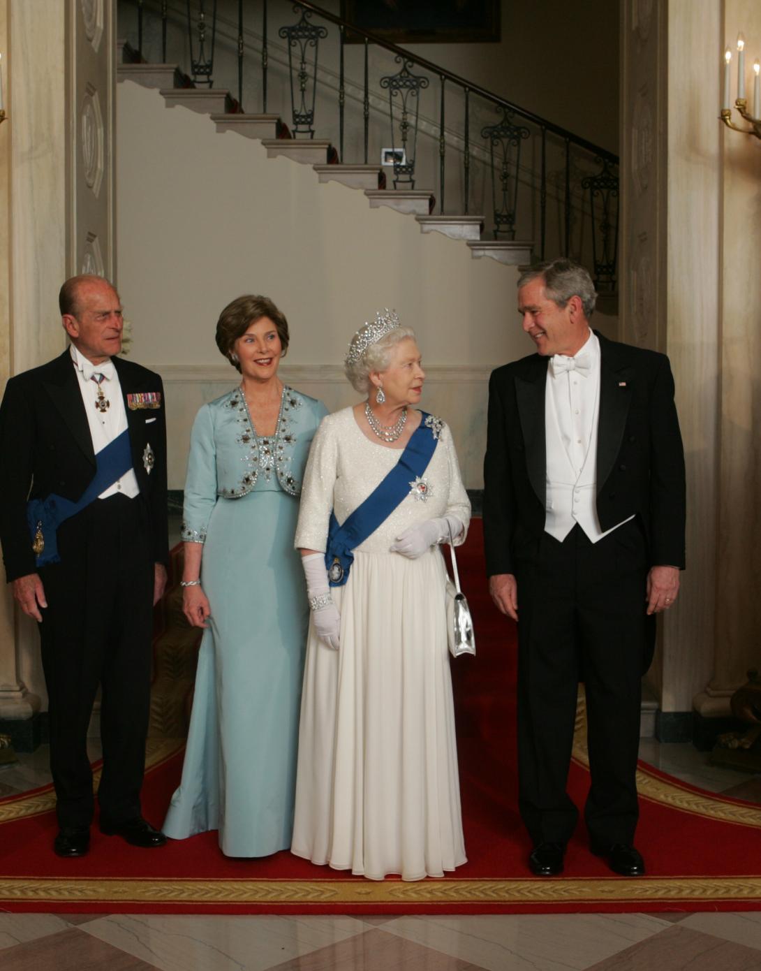 President George W. Bush and Mrs. Laura Bush Escort Her Majesty Queen Elizabeth II and His Royal Highness The Prince Philip, Duke of Edinburgh, from the Grand Staircase.