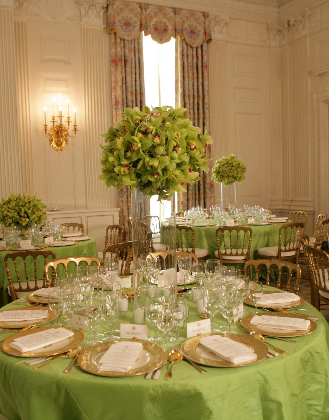 Mrs. Laura Bush with table settings for dinner for Prime Minister Junichiro Koizumi of Japan, June 29, 2006.