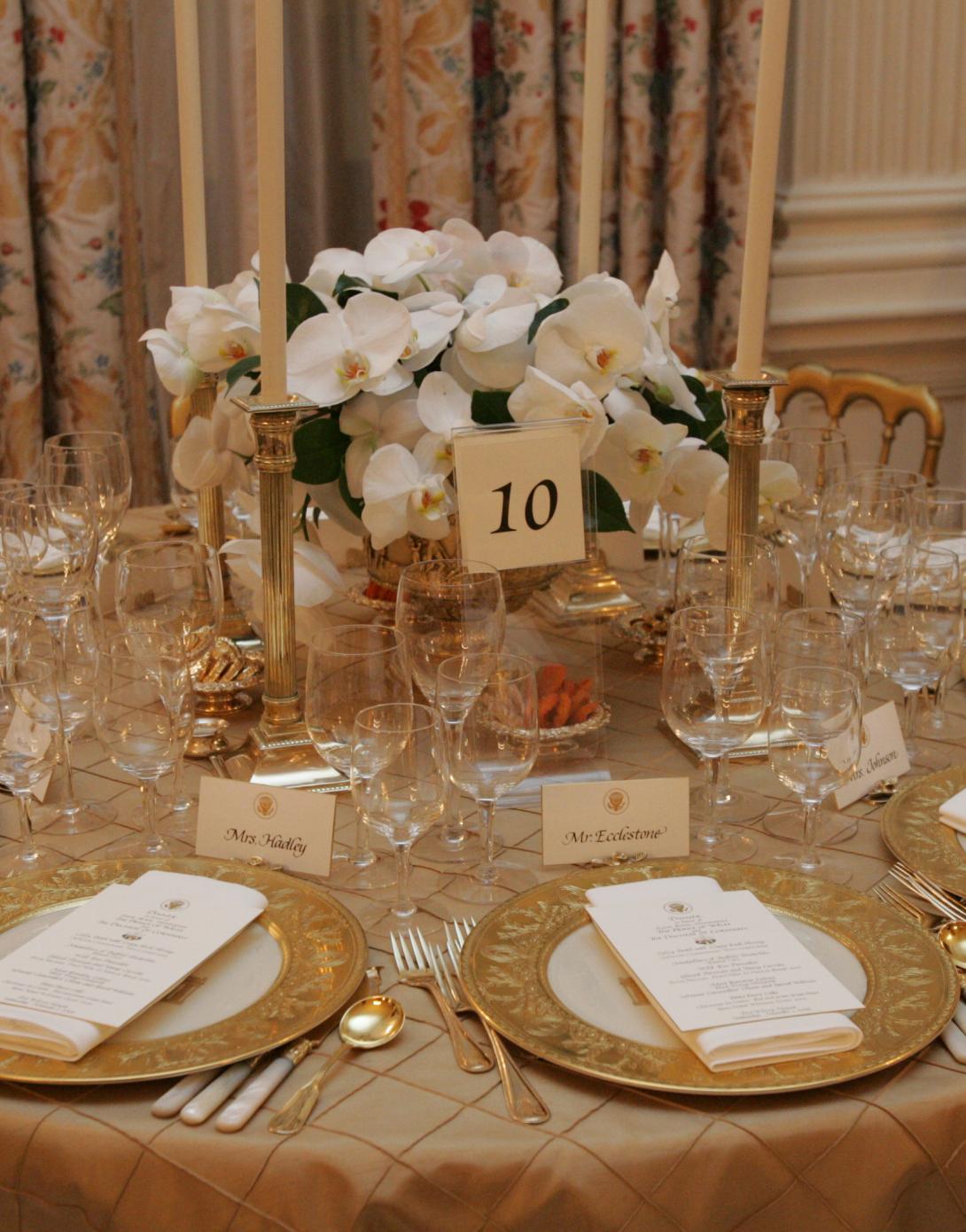Table settings in the State Dining Room for the White House dinner in honor of the Prince of Wales and Duchess of Cornwall, November 2, 2005.