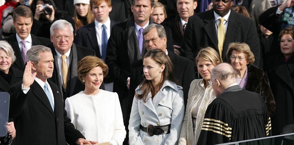 President George W. Bush places his hand on the Bible as he takes the oath of office