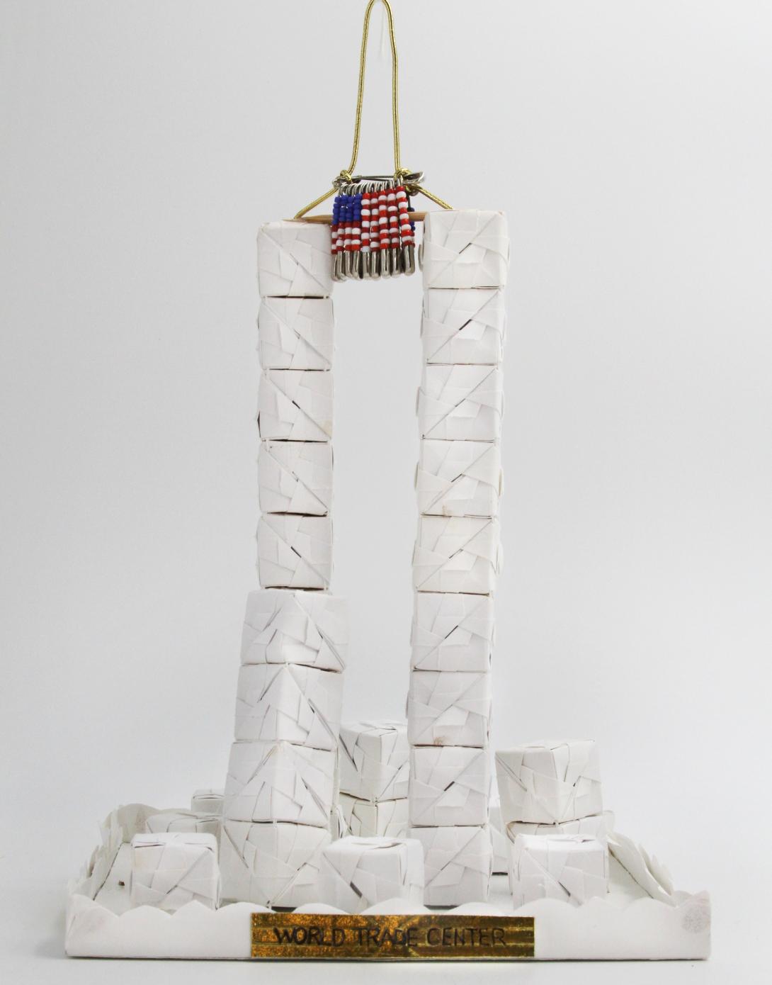 White folded paper blocks forming the World Trade Center twin towers by artist Mei-Kuei Chan Cruise. Originally displayed on the Blue Room Christmas tree in 2001.