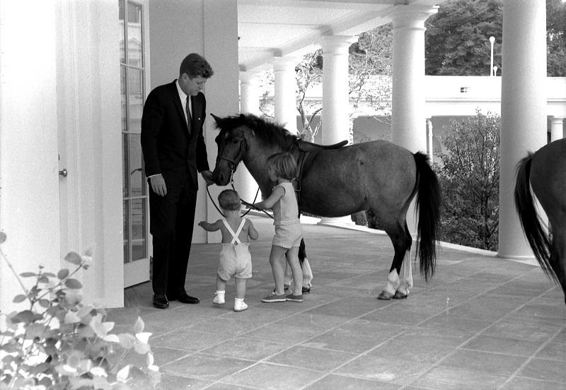 President Kennedy with Caroline Kennedy, John F. Kennedy, Jr., & Macaroni the pony, June 22, 1962. Robert Knudsen, White House Photographs. John F. Kennedy Presidential Library and Museum, Boston. KN-22365. 
