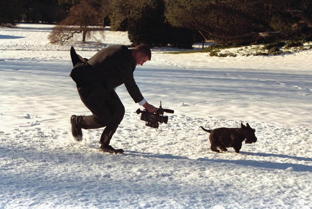 A videographer chases Barney across the South Lawn for a segment of the 2002 Barney Cam.  Photo by Paul Morse, George W. Bush Presidential Library. P24780-23.